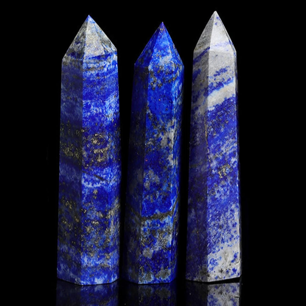Three tall, polished blue lapis lazuli crystals standing upright against a black background.