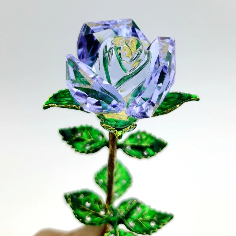 Handcrafted crystal glass rose vase with purple petals and golden leaves on a stem