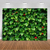 A dense green tropical palm leaf backdrop featuring lush leaves and small red flowers.