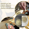 Close-up of imitation gold leaf sheets being applied to a surface for gilding and crafting projects.