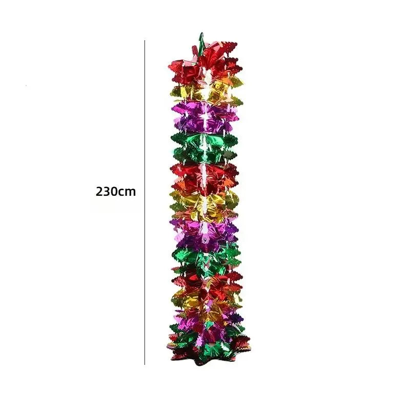 A vertical display of shimmering tinsel garland ribbon in various Christmas colors like red, green, gold, and purple.