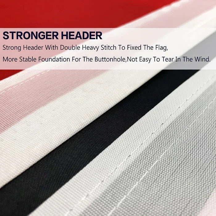 Close-up view of a striped flag banner with a black and white design.