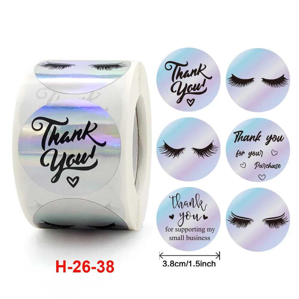 Roll of gold foil thank you sealing stickers with a face design for gifts and packaging