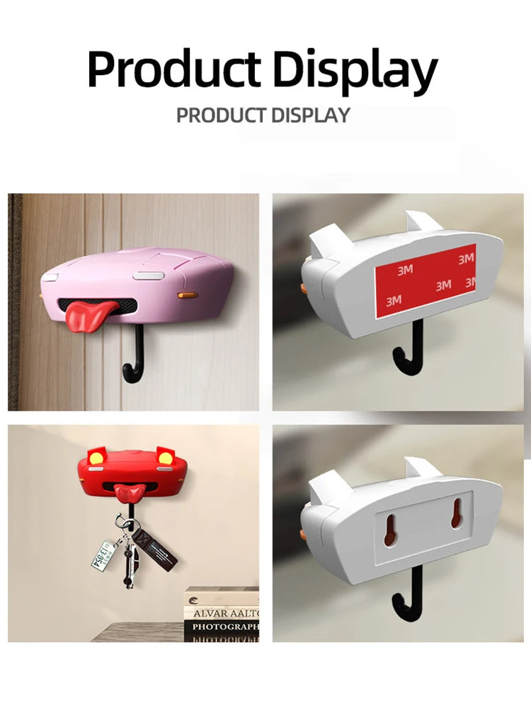 A display of various classic car headlight key holders with LED illumination in pink, red, and white.
