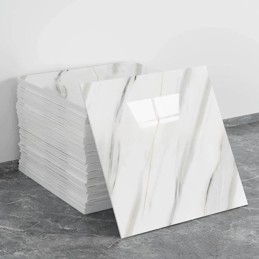 A stack of white marble tile stickers displayed on a gray surface.