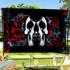 A black flag tapestry featuring a skull design surrounded by red and blue roses.