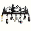 Black industrial iron wall mount key holder featuring seven hooks shaped like mountain silhouettes
