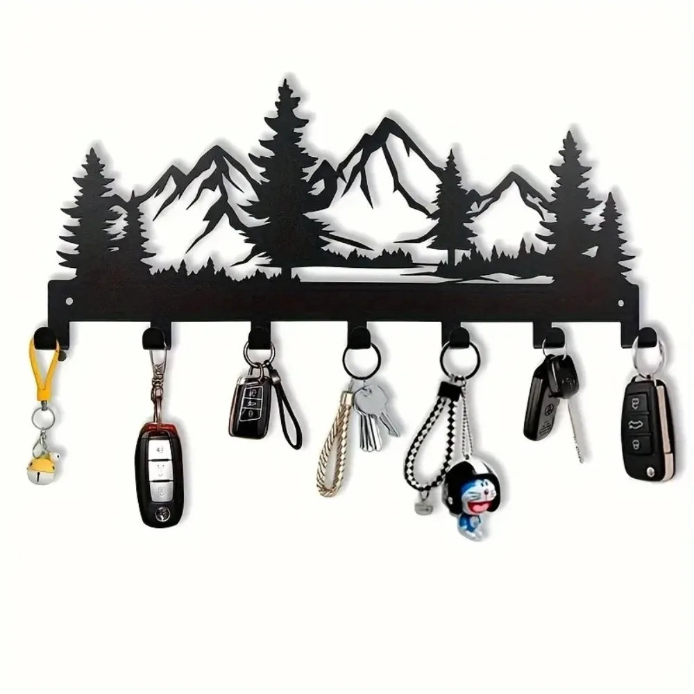 Black industrial iron wall mount key holder featuring seven hooks shaped like mountain silhouettes