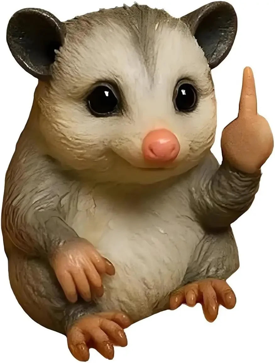 A small resin statue of a mouse with gray and white fur, large eyes, and a pink nose.