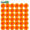 A grid of thirty bright orange artificial carnation and marigold flower heads for festive decoration.