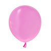 A single, smooth, matte pink latex balloon tied at the neck.