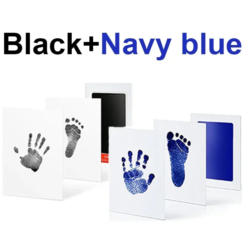 Black and navy blue handprint and footprint ink pad kit displayed on a white background.