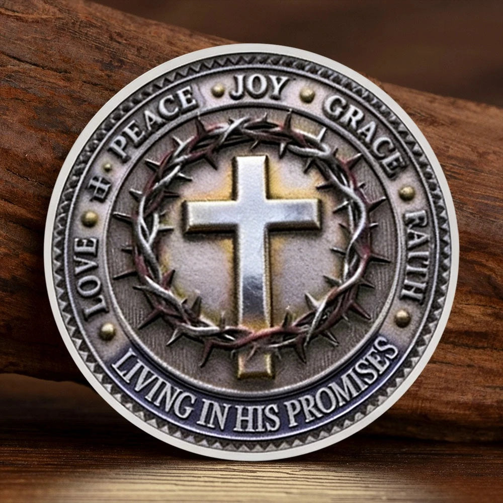 A silver commemorative coin featuring a cross surrounded by virtues like joy peace grace and faith promises