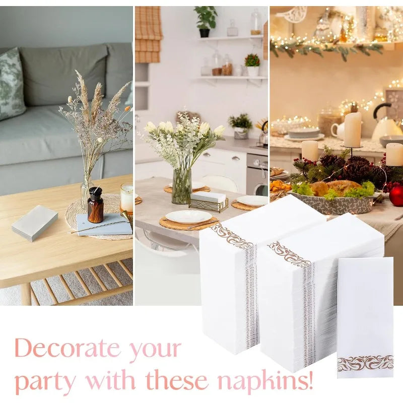 A set of white paper dinner napkins with rose gold trim displayed next to floral arrangements and tableware.