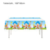 A colorful tablecloth featuring cartoon characters suitable for a circus theme birthday party decor set.