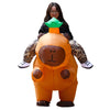 An inflatable orange capybara costume with green ears and a brown face, worn by a person.