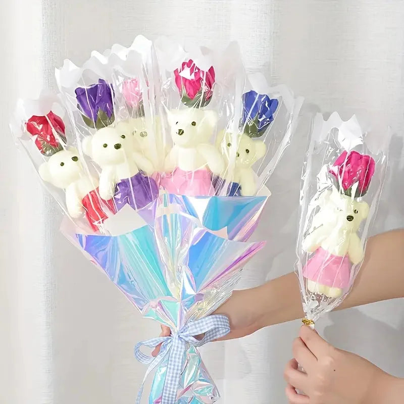 A bouquet of artificial rose soap flowers wrapped in clear cellophane and presented with a decorative ribbon.