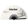 A white folding fan with a custom name printed on the surface and featuring a scenic landscape design.
