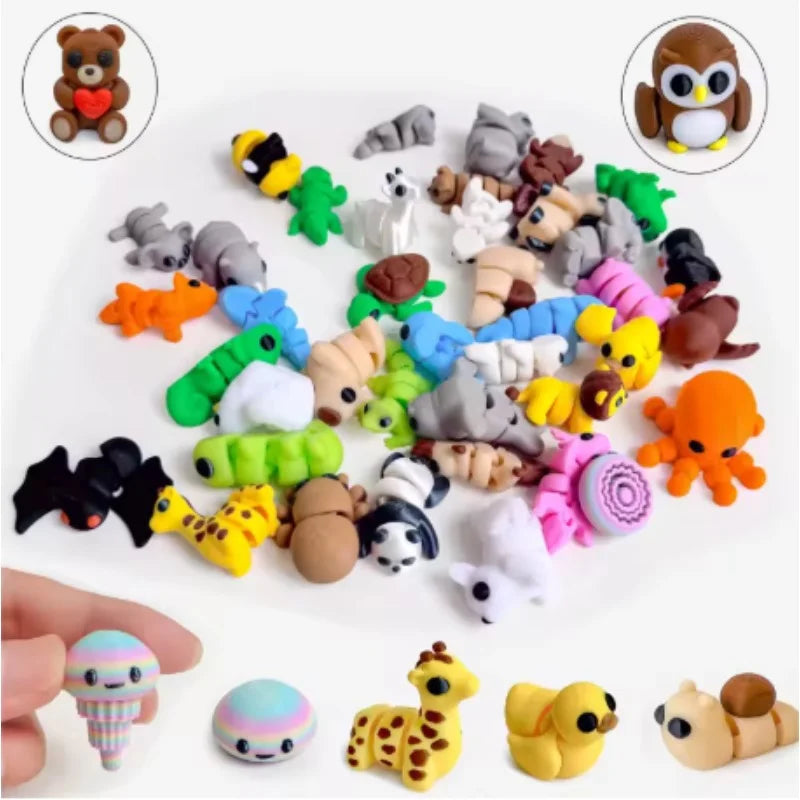 A collection of small, articulated animal figurines in various colors and styles, including bears, cats, and other creatures.