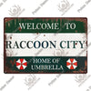 A vintage metal sign with distressed green and white paint welcoming visitors to Raccoon City, home of Umbrella.