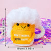 Handmade crochet potato doll with a white fluffy hat and an inspirational card