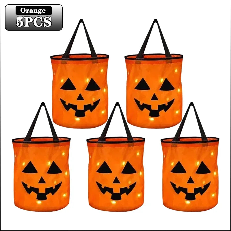 Five orange Halloween pumpkin tote bags with LED light-up handles