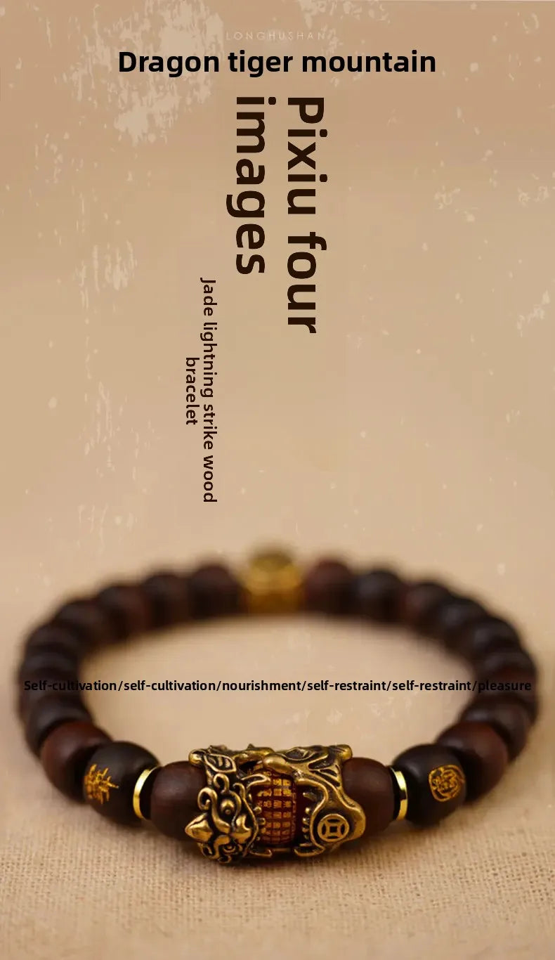 A close-up of a handcrafted Pixiu bracelet made with dark wood and semi-jade beads.