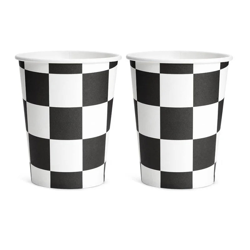 A set of two black and white checkered paper cups for a birthday racing car party decoration.