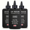 Three bottles of hard UV resin for artists with black dropper caps and labels