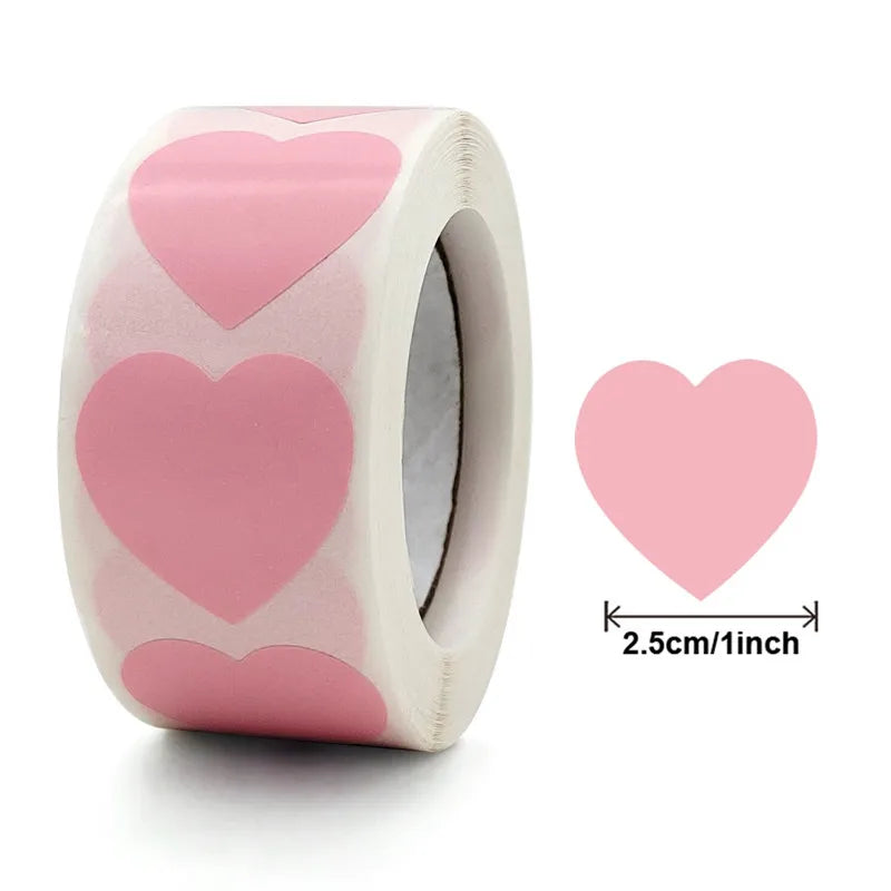 Roll of pink heart-shaped seal stickers for crafting and packaging