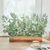 A lush arrangement of mixed green eucalyptus and willow artificial flowers displayed in a wooden box.