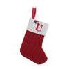 A red knitted sock with a white U letter decoration and a red loop for hanging.