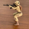 A tactical female rifleman desktop figurine in camouflage attire aiming a rifle.