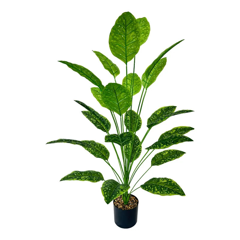 A lush green artificial tree with large leaves used for indoor and outdoor decor.