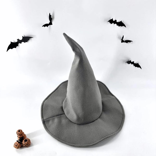 A gray witch hat is centered on a white background surrounded by black bats.