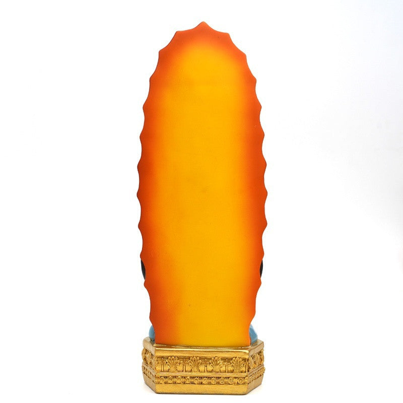 Hand-painted resin statue of Our Lady of Guadalupe with an orange and yellow gradient finish mounted on a gold base
