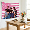 Pink retro American flag tapestry featuring a vintage-inspired design with several people.