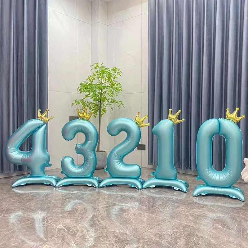 Large blue foil number balloons spelling out 43210 arranged in a row against a light background