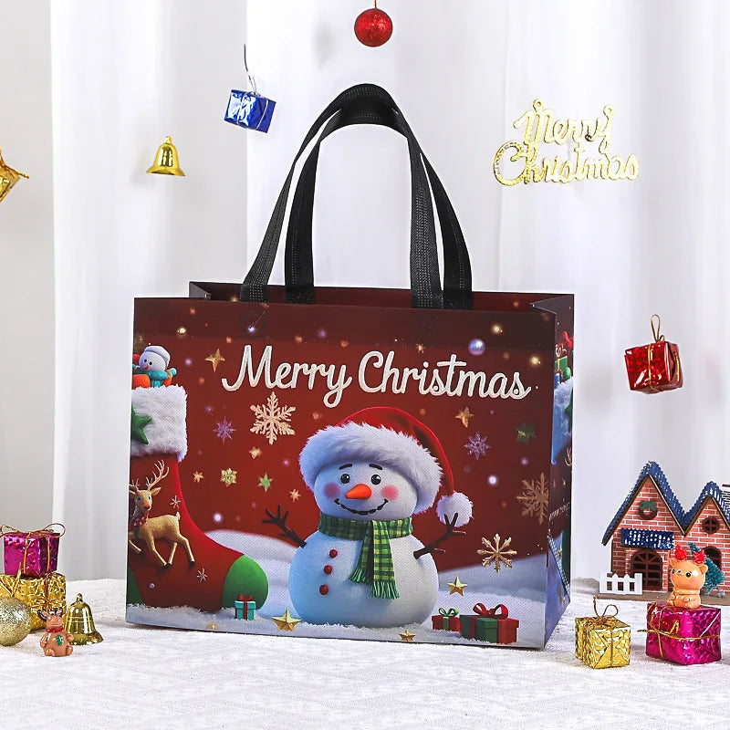 A brown reusable non-woven Christmas gift bag with black handles decorated with a snowman and festive holiday elements.