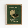 A framed canvas art print featuring green background text that reads If it's nice play it twice