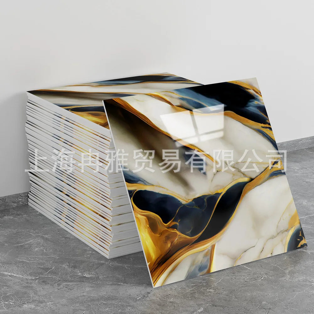 A stack of faux marble 3D self-adhesive wall tiles featuring abstract gold and blue marble patterns.