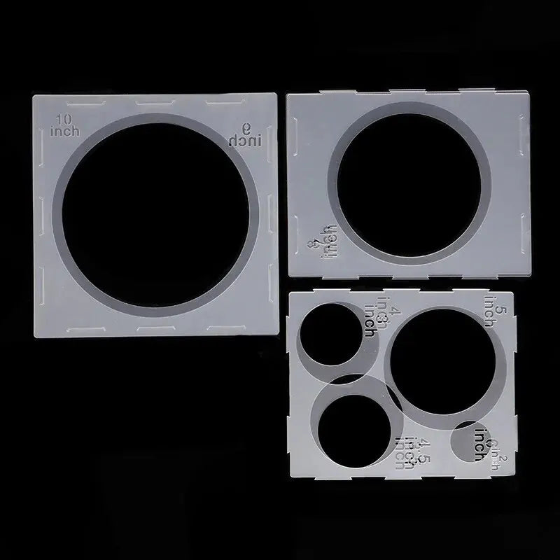 A set of plastic sizing boxes with various circular holes for balloon decor.