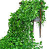 Lifelike artificial ivy vine garland cascading down a wooden stand for wall decor