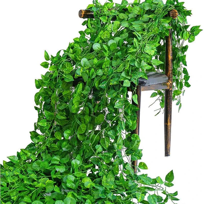 Lifelike artificial ivy vine garland cascading down a wooden stand for wall decor
