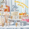 A baby shower party setup featuring mini plush teddy bear keychains and various decorative items.