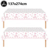 Pink bow themed birthday party supplies set featuring two rectangular table cloths