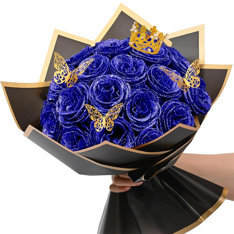 A bouquet of ten deep blue glitter artificial roses with gold butterfly accents displayed in a black decorative bowl.
