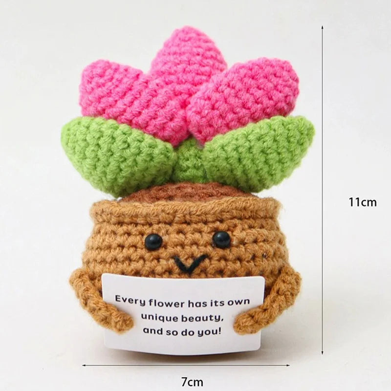 Handmade crochet potato doll with pink and green flowers and an inspirational card