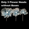 Three light blue velvet mesh flower heads without bases for wedding decoration.