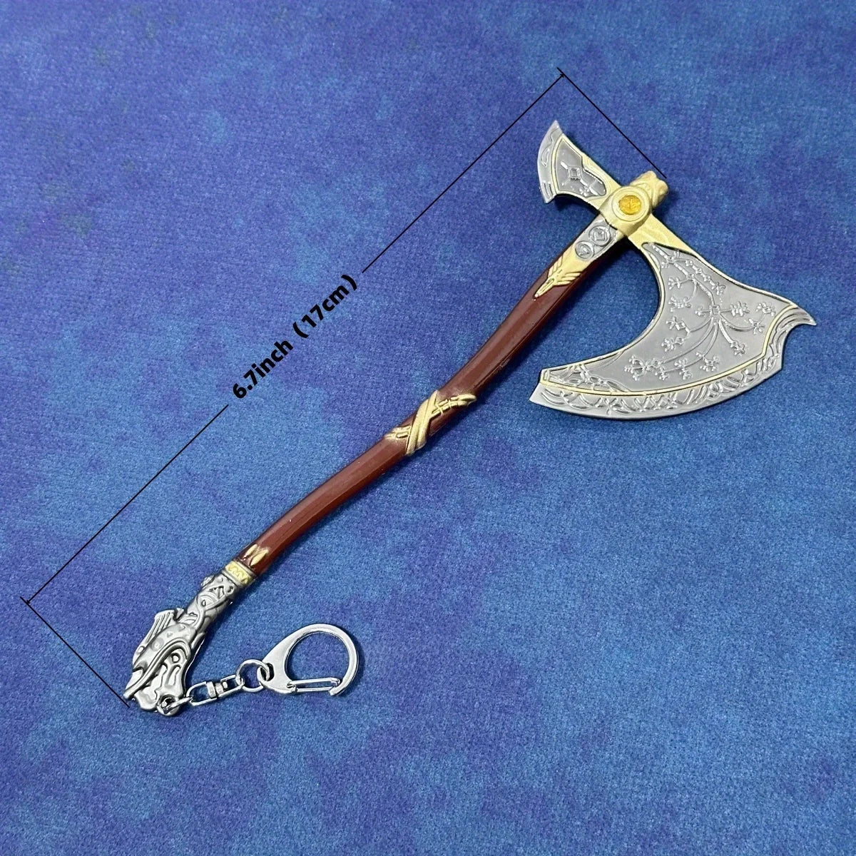 A miniature collectible sword resembling a Katana, featuring a brown hilt and a silver blade, shown against a blue background